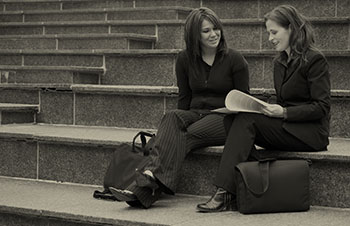 Photo of 2 people sitting on steps